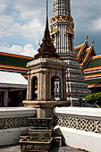 Bangkok Wat Pho, stone marker that delineates the sacred space of the bot with one of the phra prang tower at the corner of the courtyard.